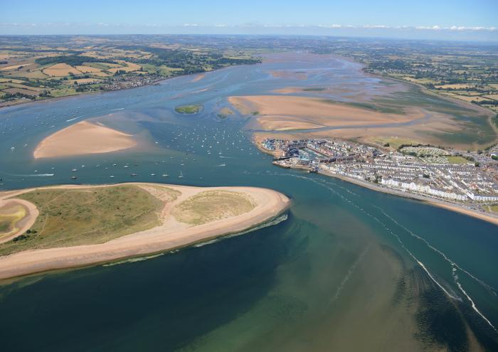An aerial photo showing the approach to the Exe Estuary from the sea.