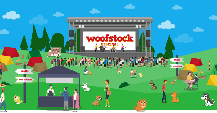 Woofstock stage with a crowd of people and dogs in the audience