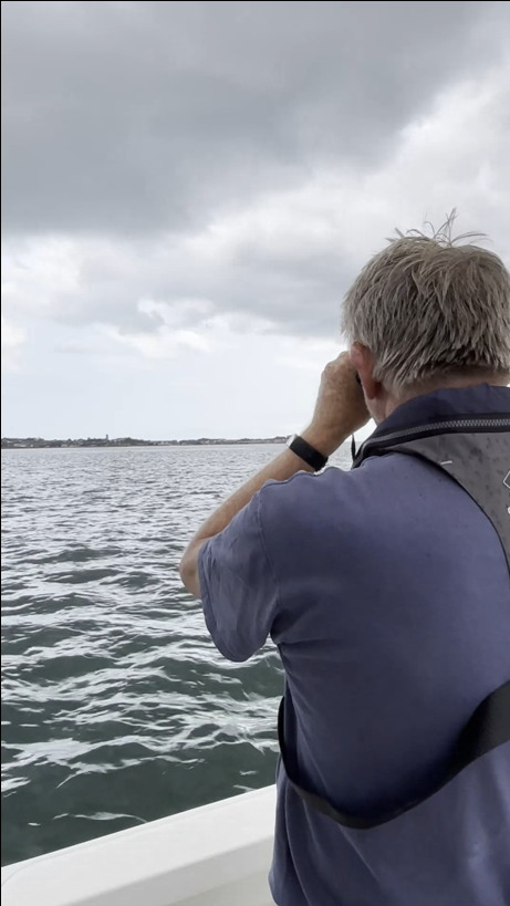 A photo of volunteer Alan on the patrol boat